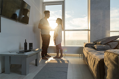 young couple in condo facing each other