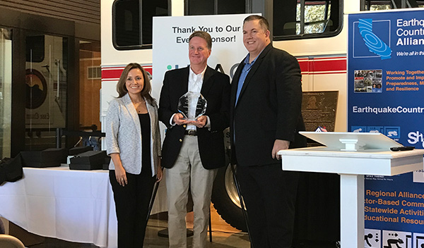 Image: CEA receiving award from Mark Benthien, Earthquake Country Alliance