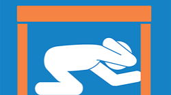 Person protecting themselves under a sturdy table during an earthquake.