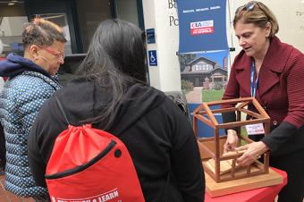 Image: CEA Chief Mitigation Officer Janiele Maffei, doing a hands-on demonstration about retrofitting